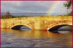 Bangor-on-Dee Bridge with the River Dee in full flood with Rainbow in background. Click to View Full Size 